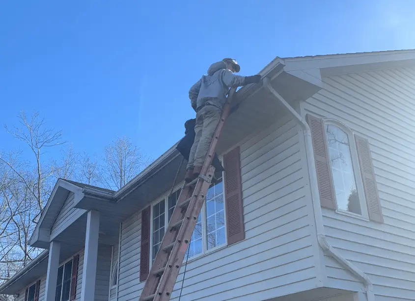 Gutter cleaning and maintenance being performed by Shaker Heights Power Washing in Shaker Heights